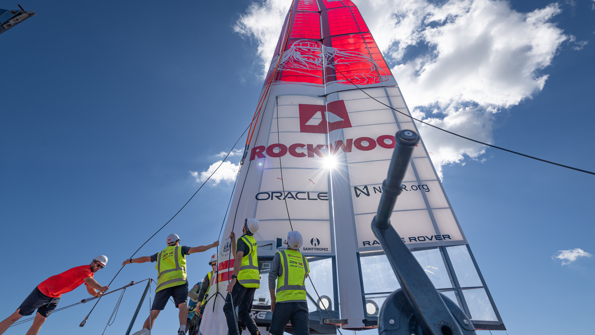 SailGP Wingsail being mounted ahead of the race. Every morning before sailing, the catamarans are assembled and craned into the water. At the end of the day, the F50s are lifted back out of the water and disassembled for maintenance.